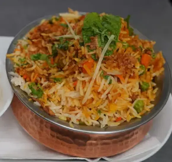 Chicken biryani and aromatic basmati rice dishes at The Social Kabob Okotoks